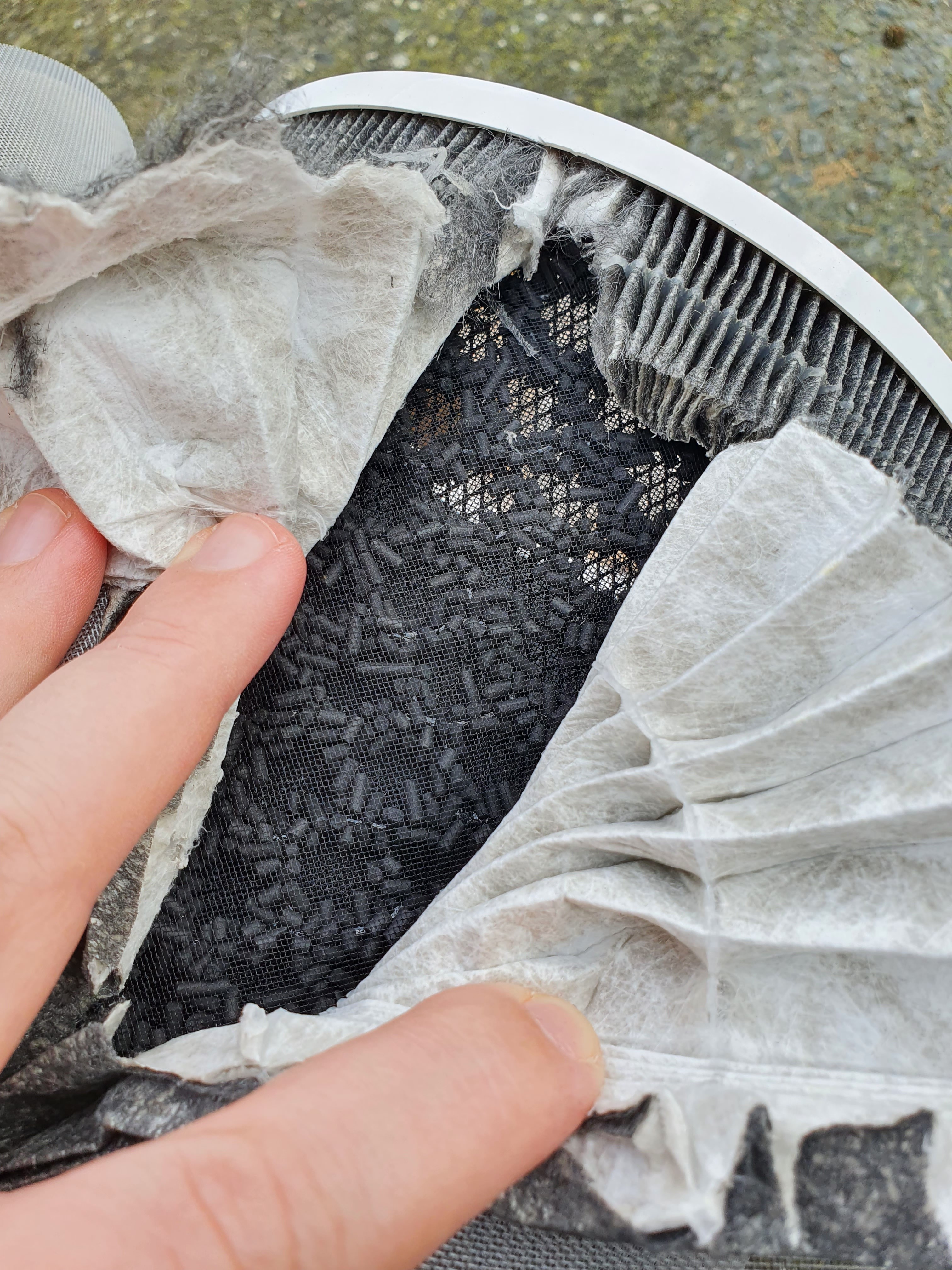 Held in a dispersed lattice after the filter materials are granules of activated carbon arranged with holes in the middle.